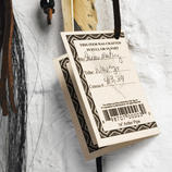 The certificate, containing the name and identification number of the Navajo artisan, confirms the authentic origin of the pipe.