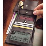  As practical as a personal organiser: 2 large compartments for notes, a secret compartment, 1 coin compartment with press stud closure , 5 credit or insurance card holders, 1 compartment for receipts/tickets, a removable compartment with press stud for your passport/ID card.