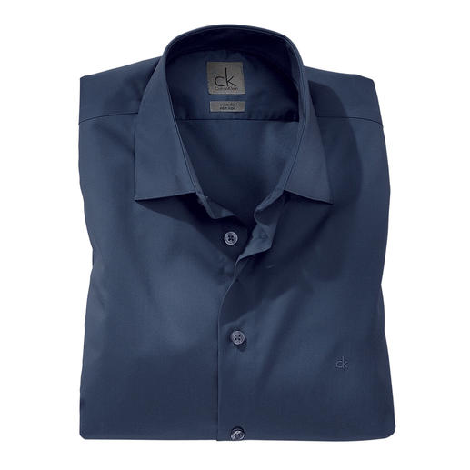 Calvin Klein Slim-Fit Shirt Your most important fashion basic. Just right for modern slender cut suits and sports jackets.